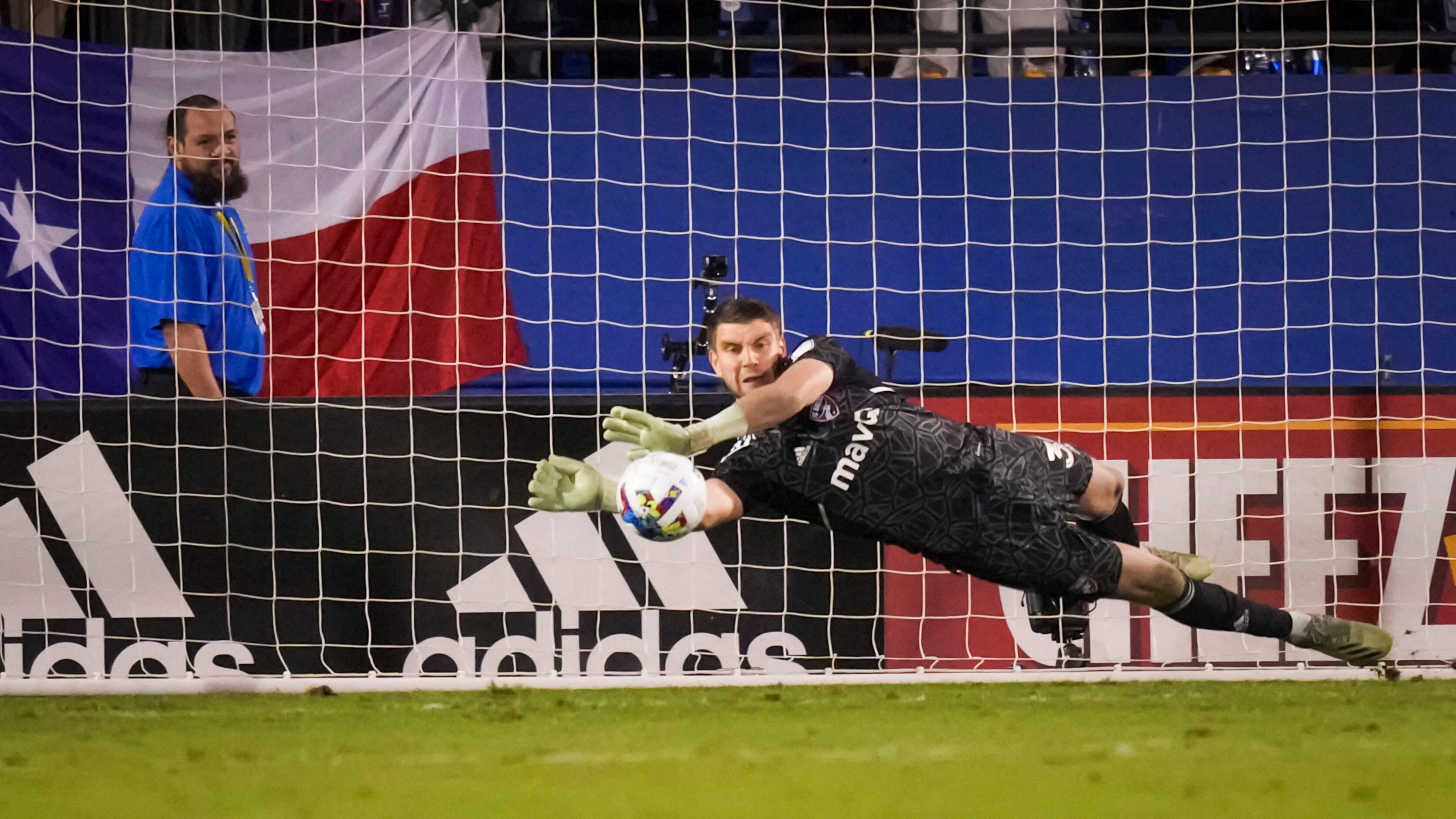 FC Dallas goalkeeper Maarten Paes (30) makes a save against Minnesota United midfielder Will...