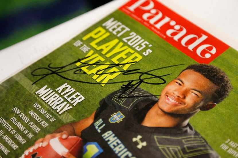 Allen quarterback Kyler Murray signed a magazine for a fan after Allen's National signing...