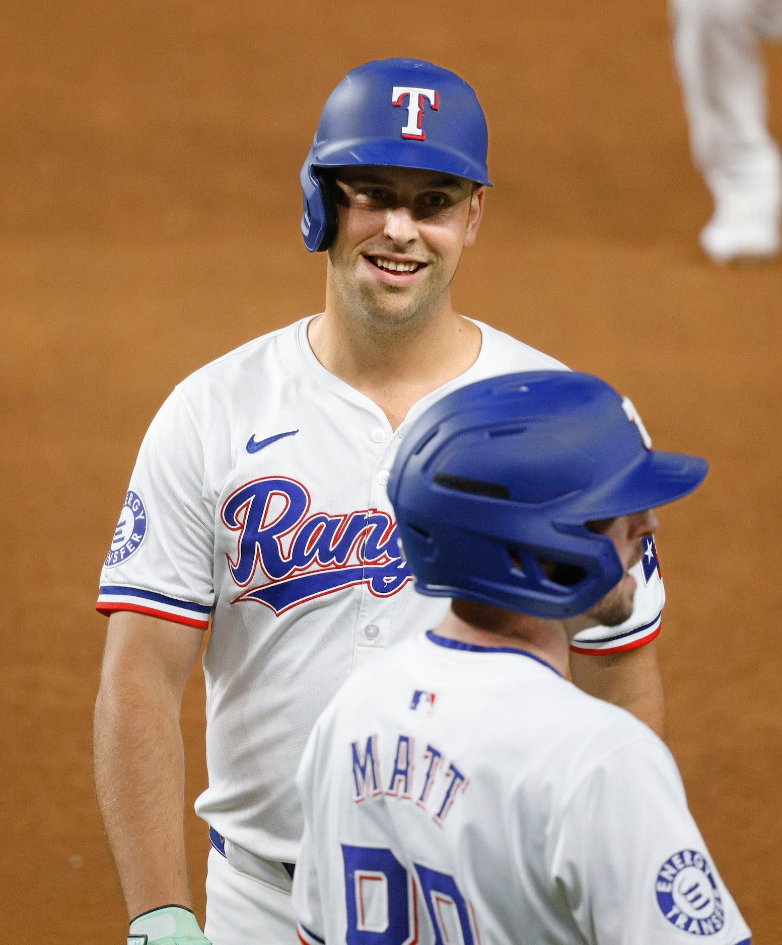 Texas Rangers’ Nathaniel Lowe (30) smiles after hitting a single during the sixth inning of...