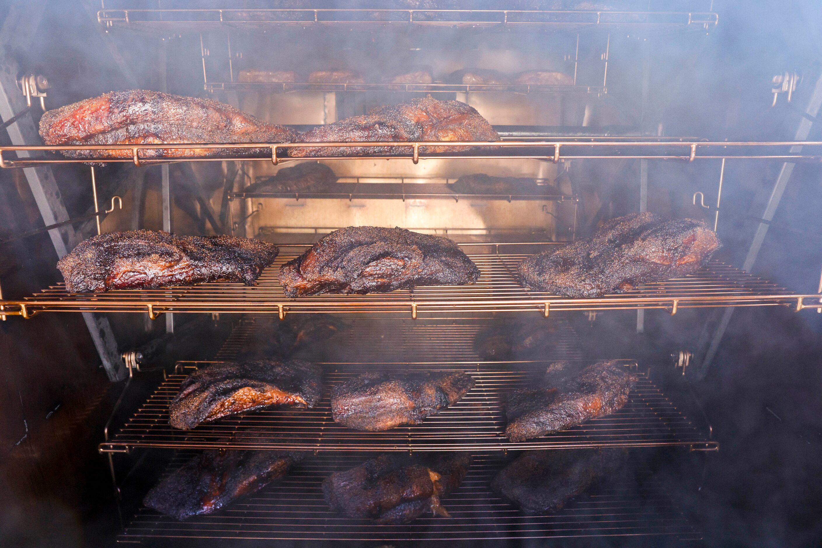 Brisket smokes inside a custom M&M smoker at Globe Life Field. The smoker was added so...