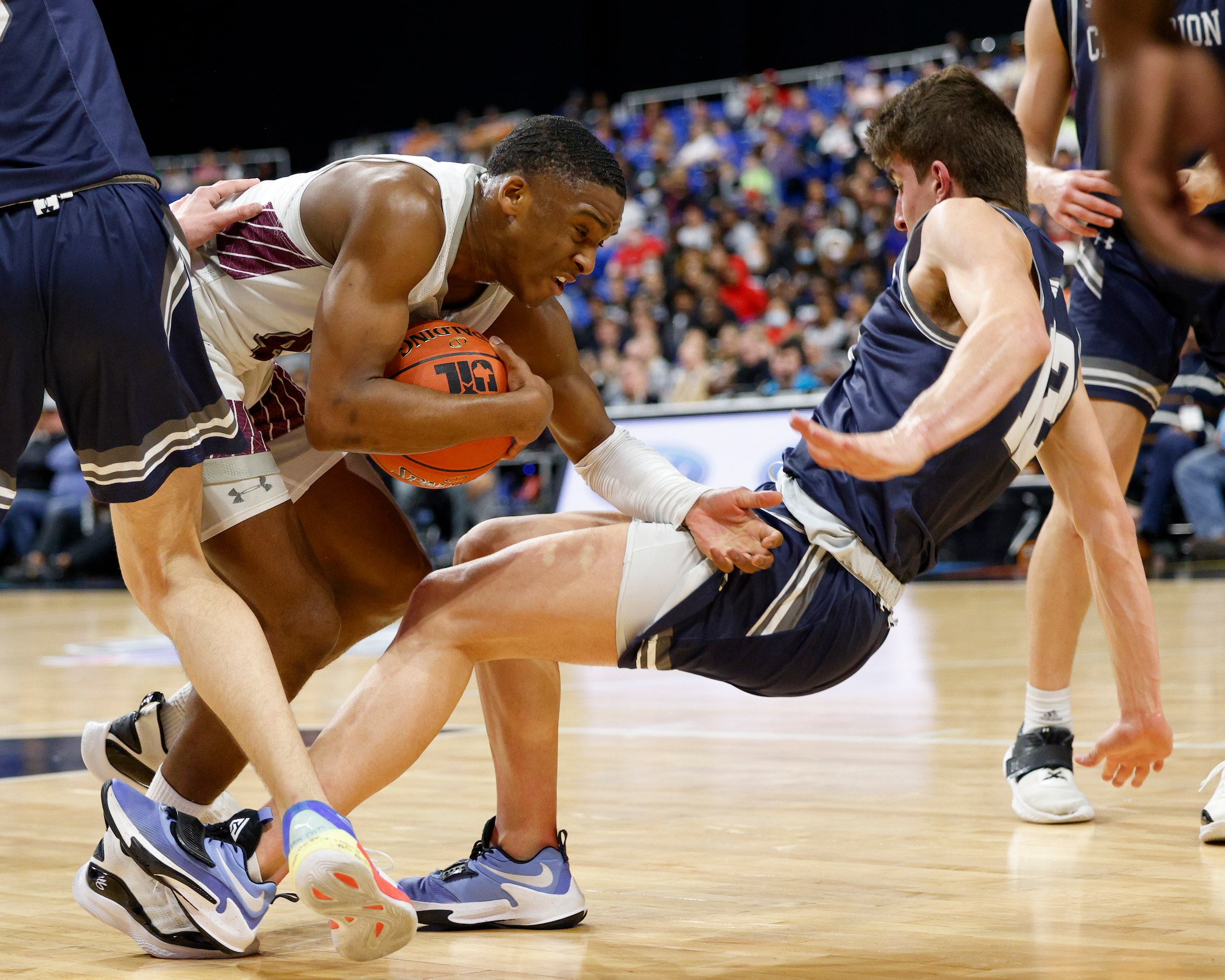 Mansfield Timberview guard Donovan O'Day (4) collides with Boerne Champion guard Braxton...