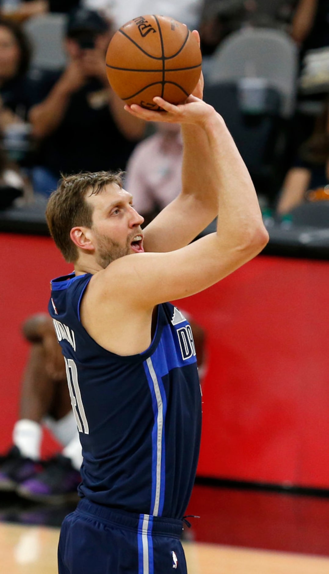 Dallas Mavericks forward Dirk Nowitzki (41) shoots during the first half of play against the...