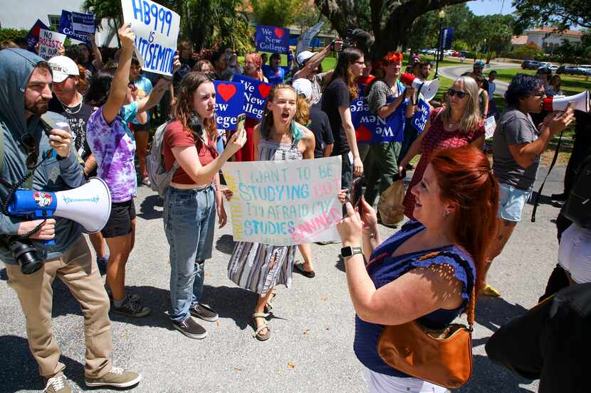 Protesters gather at the New College of Florida campus moments after Gov. Ron DeSantis...