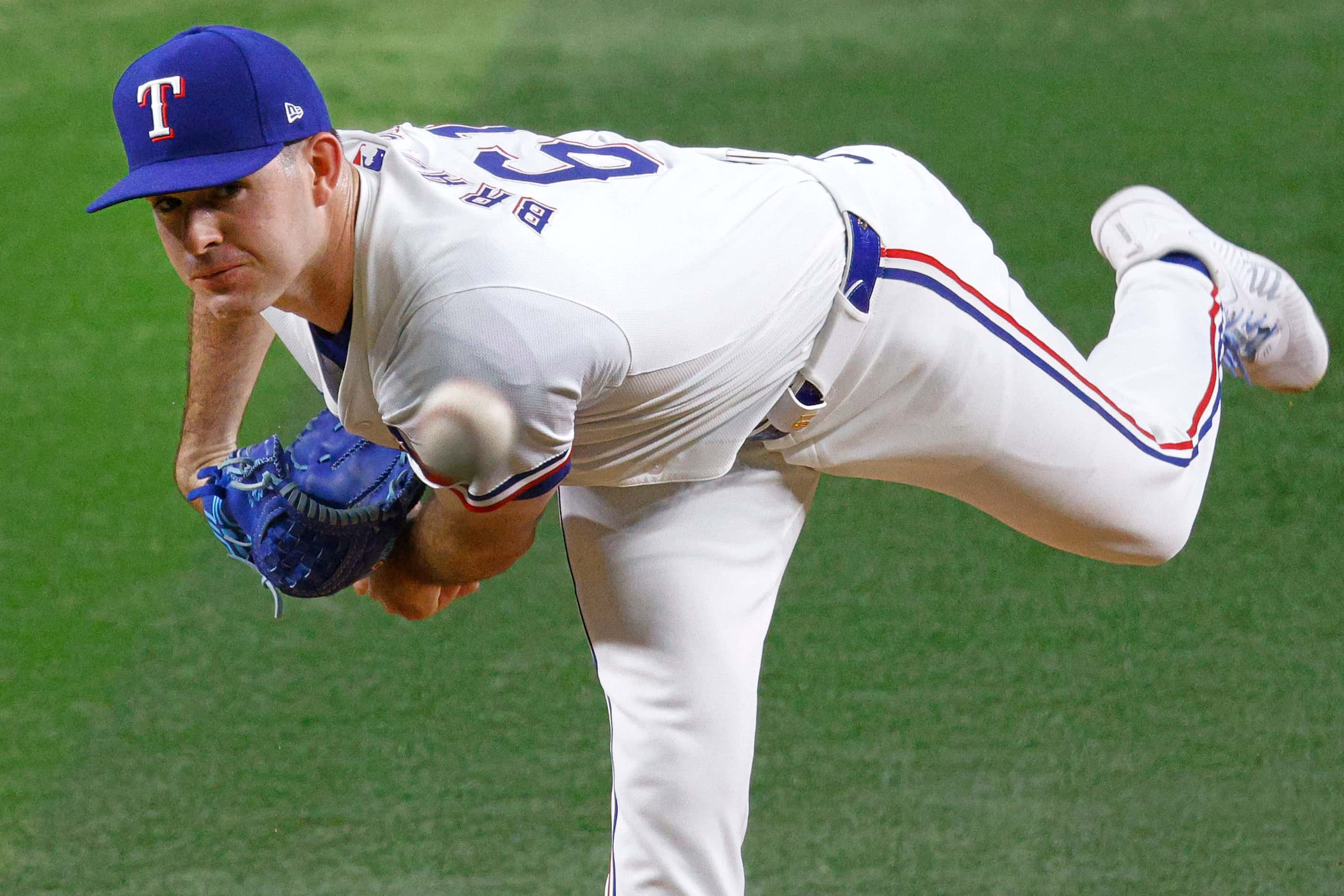 Texas Rangers pitcher Cody Bradford (61) delivers during the first inning of a baseball game...