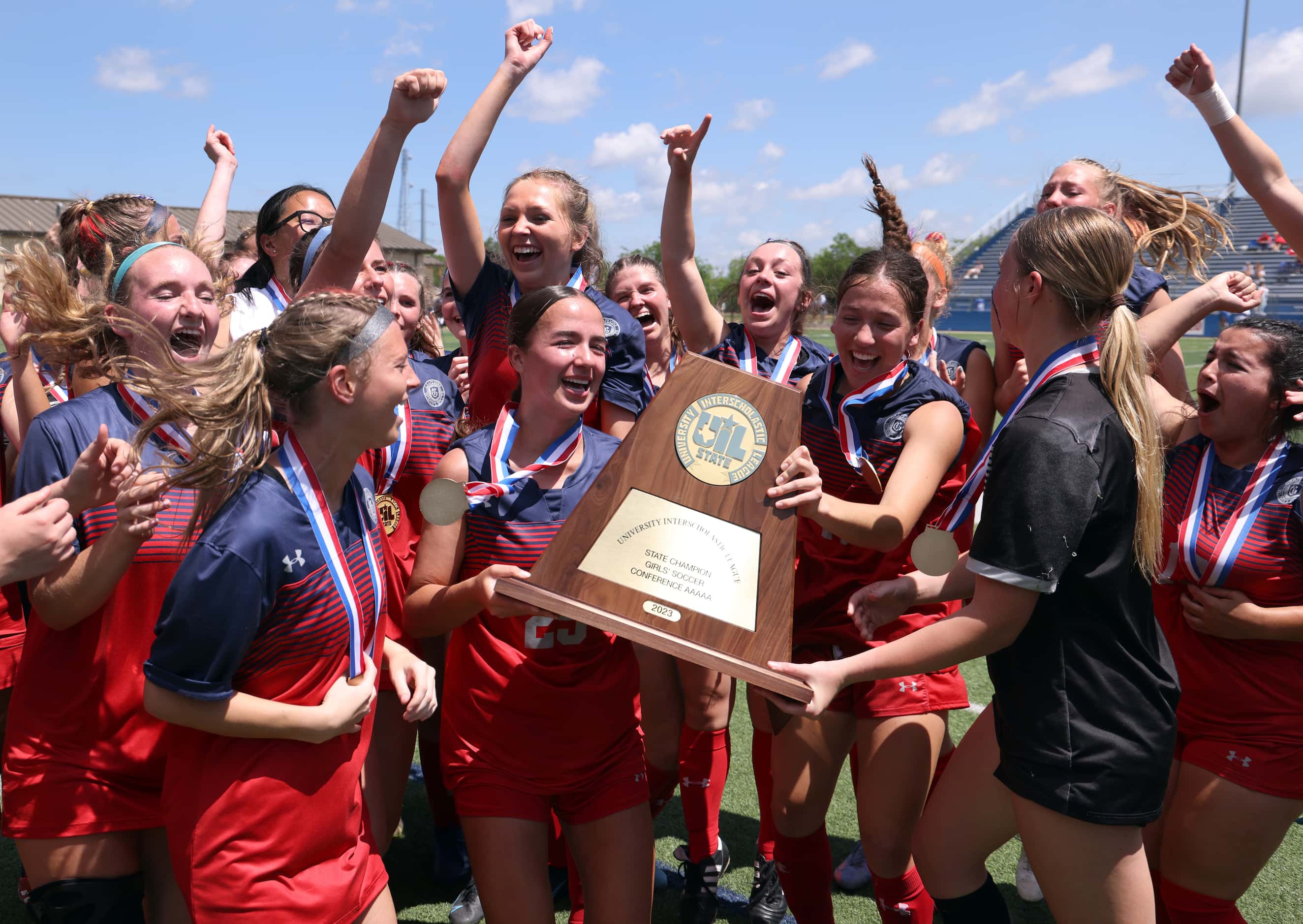 Grapevine players erupt after being presented the Class 5A state championship trophy...
