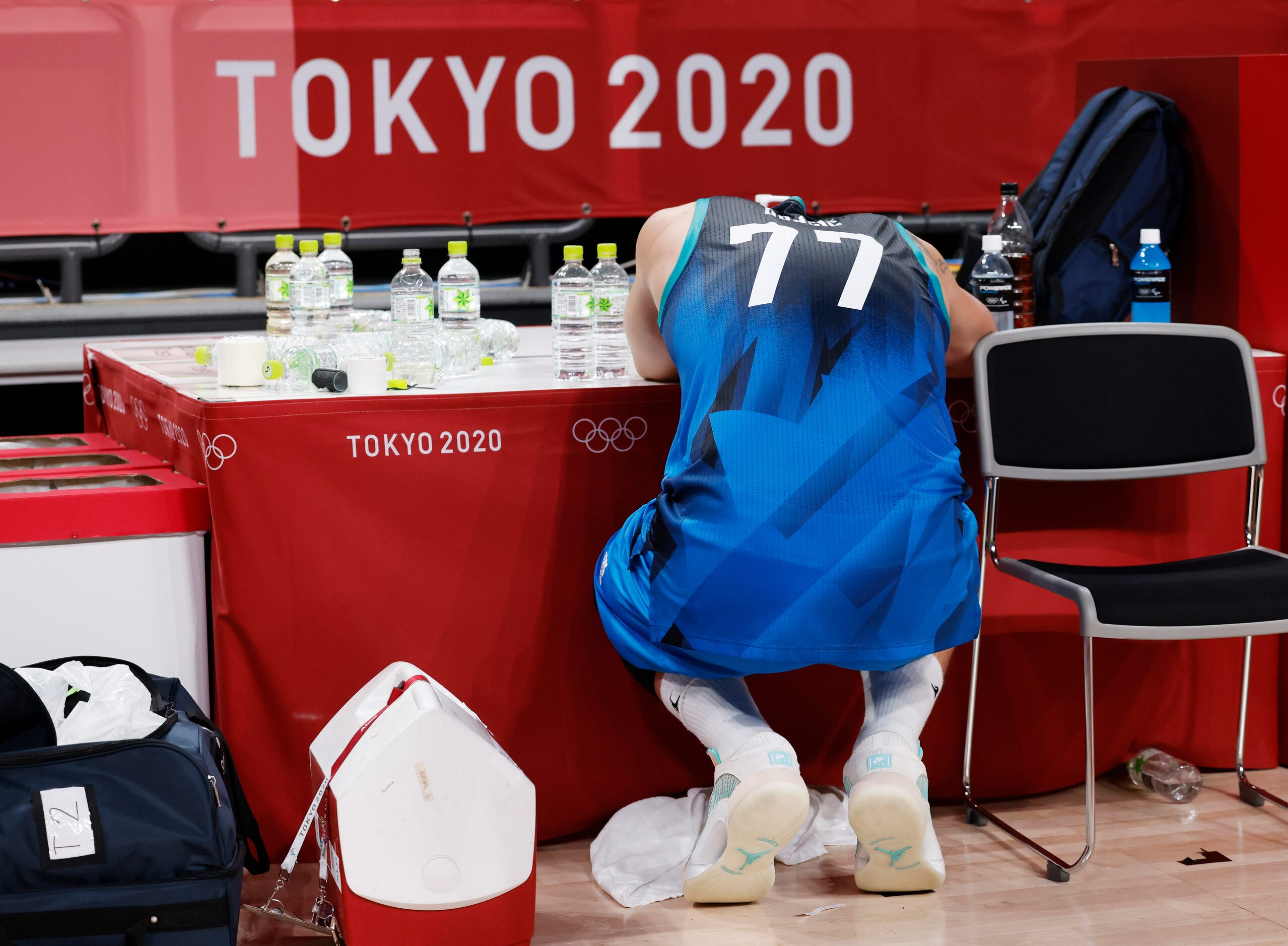 Slovenia’s Luka Doncic (77) sits dejected after losing to France 90-89 in a men’s basketball...