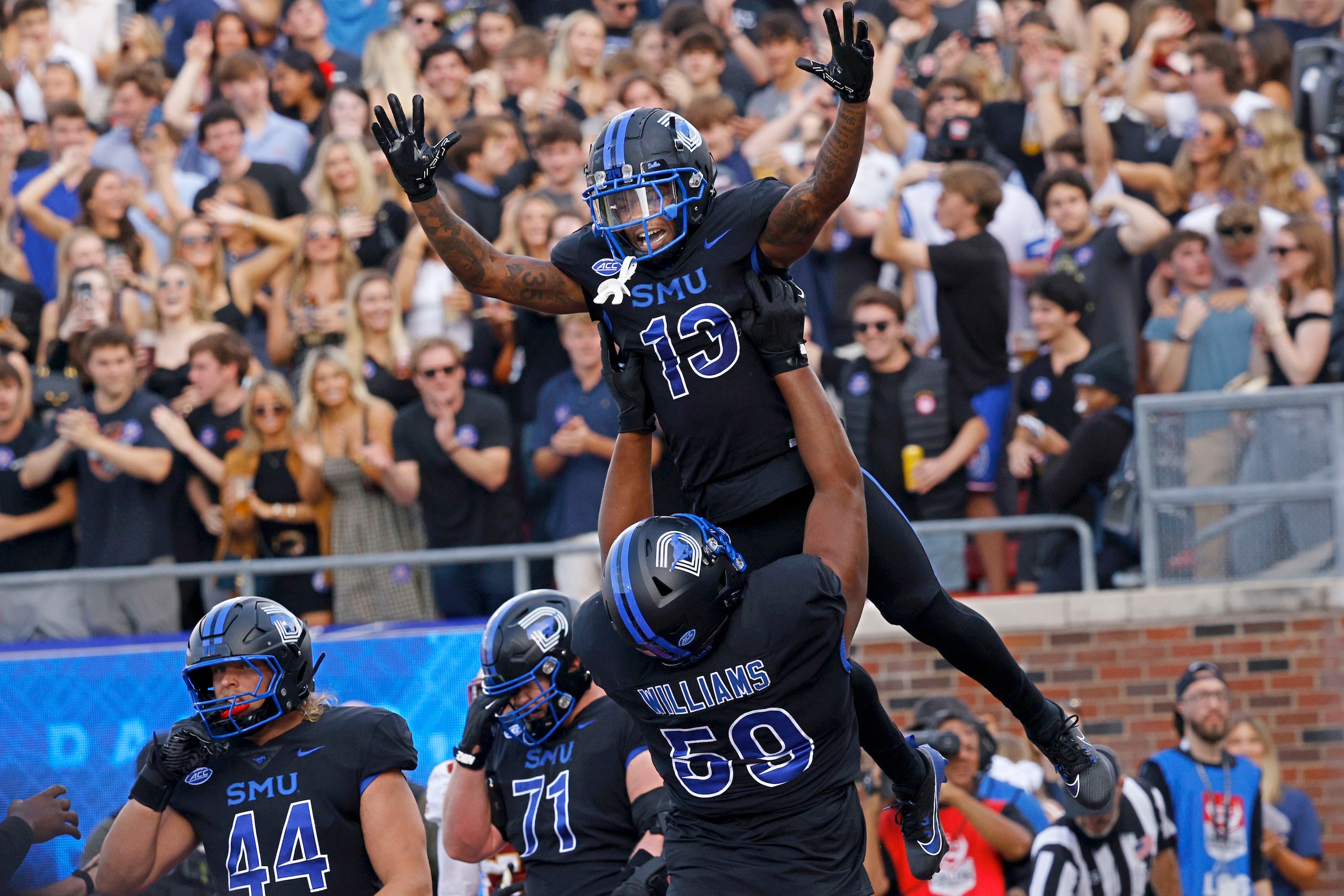 SMU wide receiver Roderick Daniels Jr. (13) celebrates with his teammate offensive lineman...