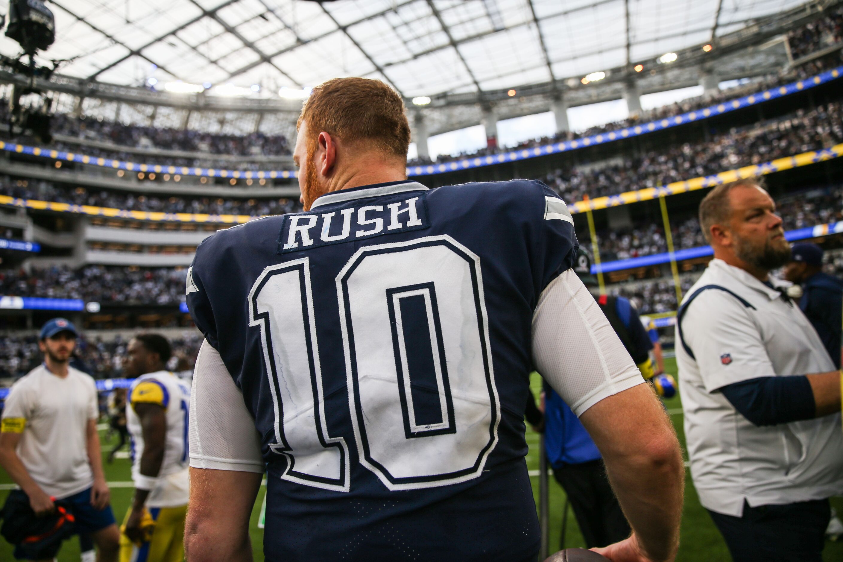 Dallas Cowboys quarterback Cooper Rush (10) walks on the field after win the game against...