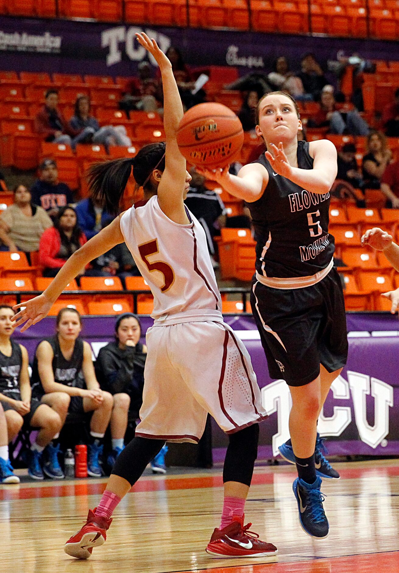 Flower Mound guard Kayla Mount (5) lays up a first half shot around El Paso El Dorado point...