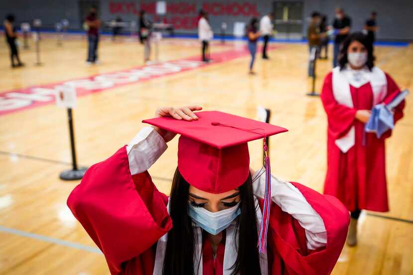 Senior Tania Pelaez Ramirez prepares to have her photo taken for use in the school's virtual...