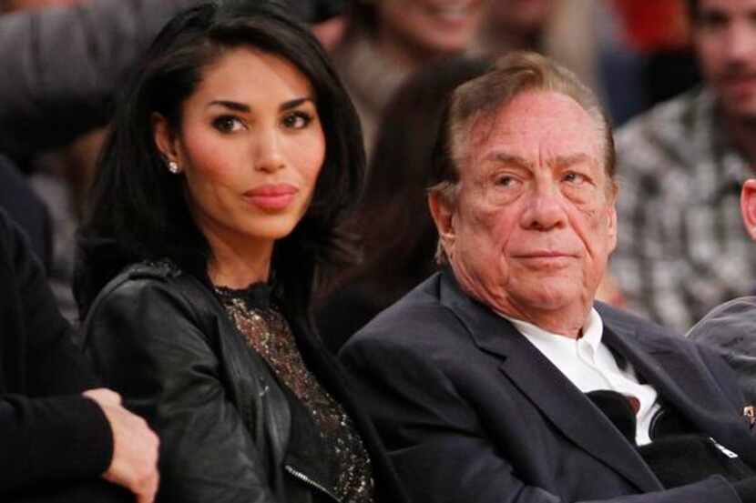 
Los Angeles Clippers owner Donald Sterling and V. Stiviano, left, watch the Clippers play...