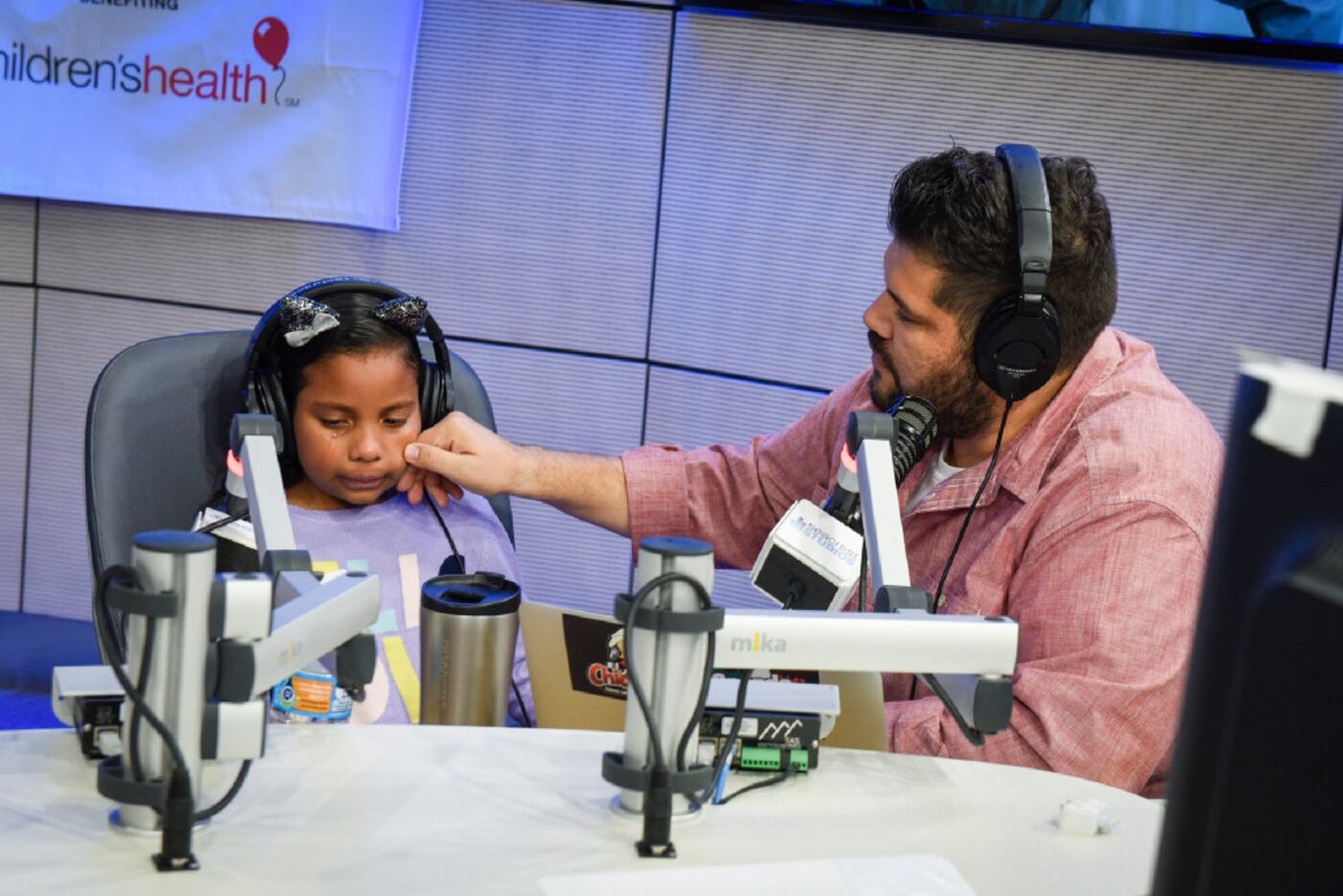 Ely Cruz, a hematology patient, gets emotional when asked by 107.5 morning personality El...