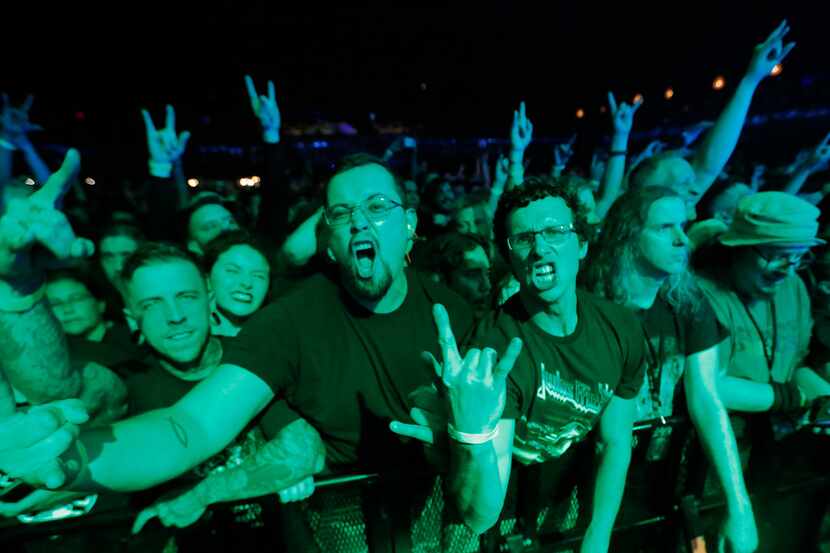 Lamb of God fans get into the music as the band performs in concert at the Bomb Factory in...