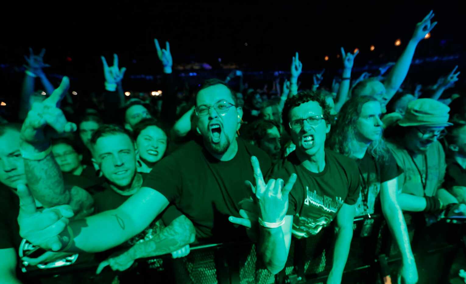 Lamb of God fans get into the music as the band performs in concert at the Bomb Factory in...