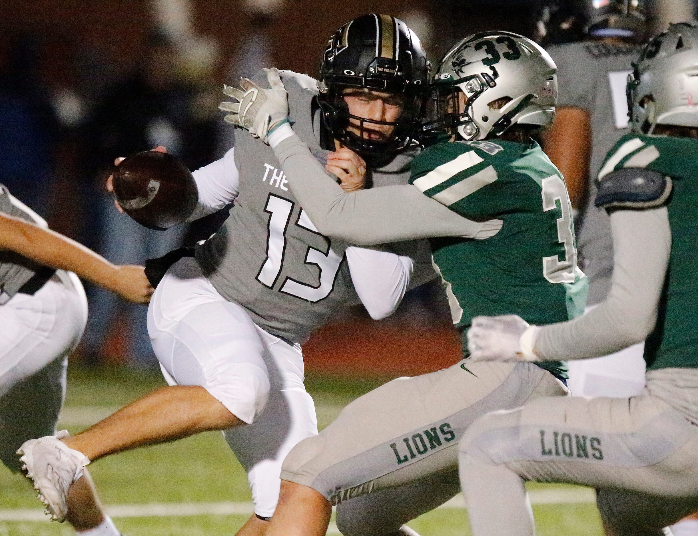 The Colony High School quarterback Dylan Corbin (13) is met by Frisco Reedy High School...