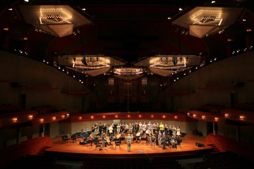 Richard Sparks, the Collegium Singers’ director, rehearses with the choir and Baroque...