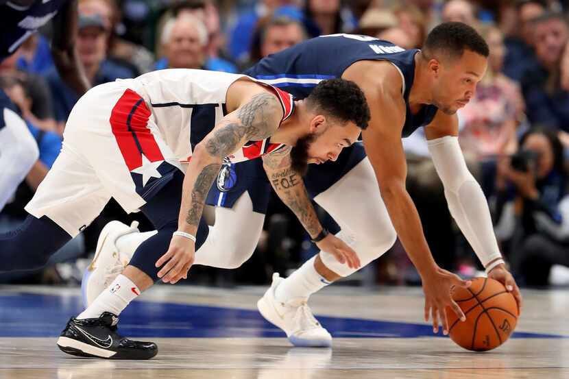 DALLAS, TEXAS - OCTOBER 23: Chris Chiozza #9 of the Washington Wizards scrambles for the...