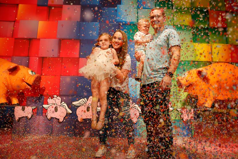Vinny and Heather Torregrossa, and their children Emersyn, 4, and Lennon, 2, play in a cloud...