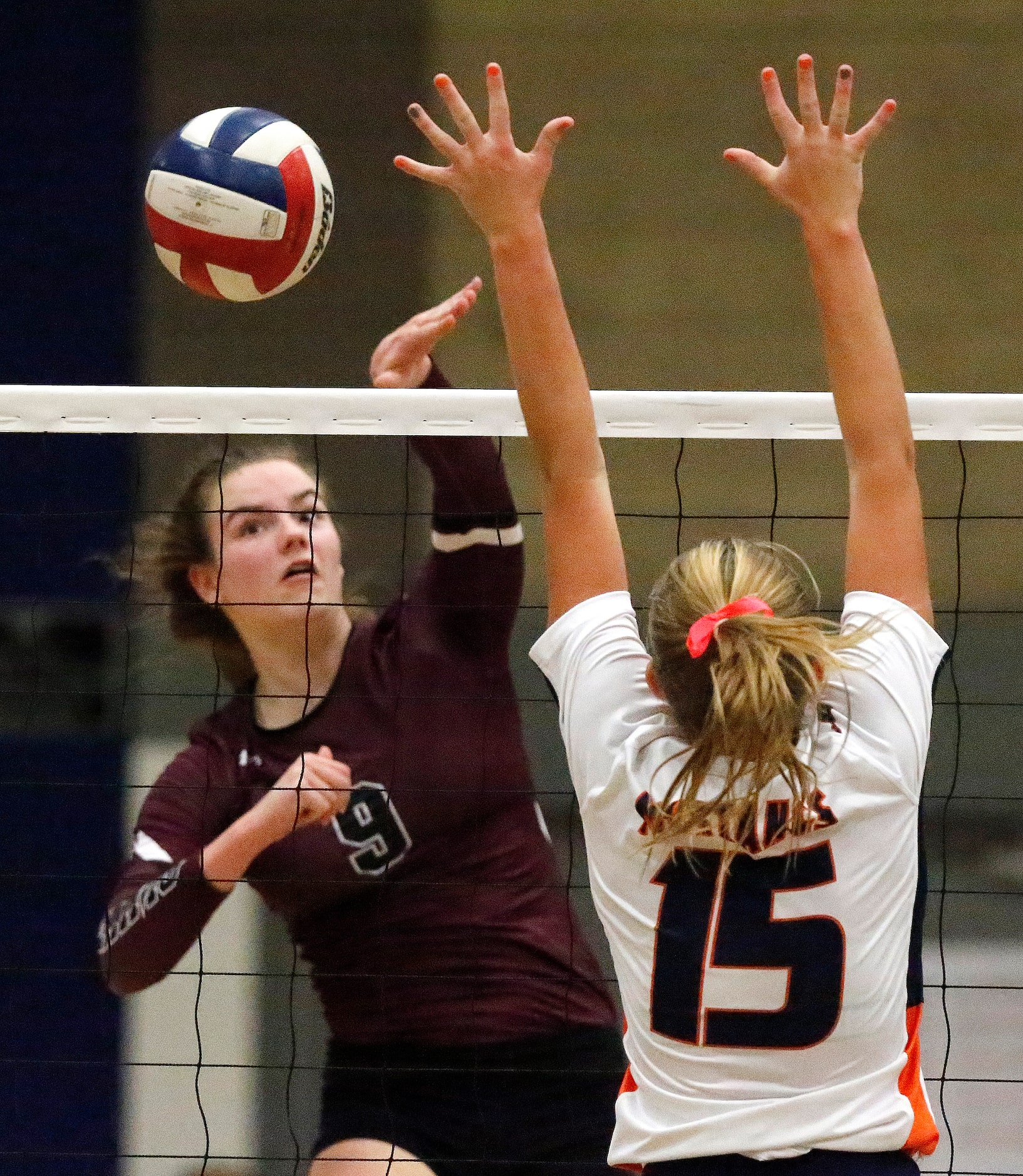 Wylie High School setter Ana Heath (9) hits past Sachse High School outside hitter Macy...