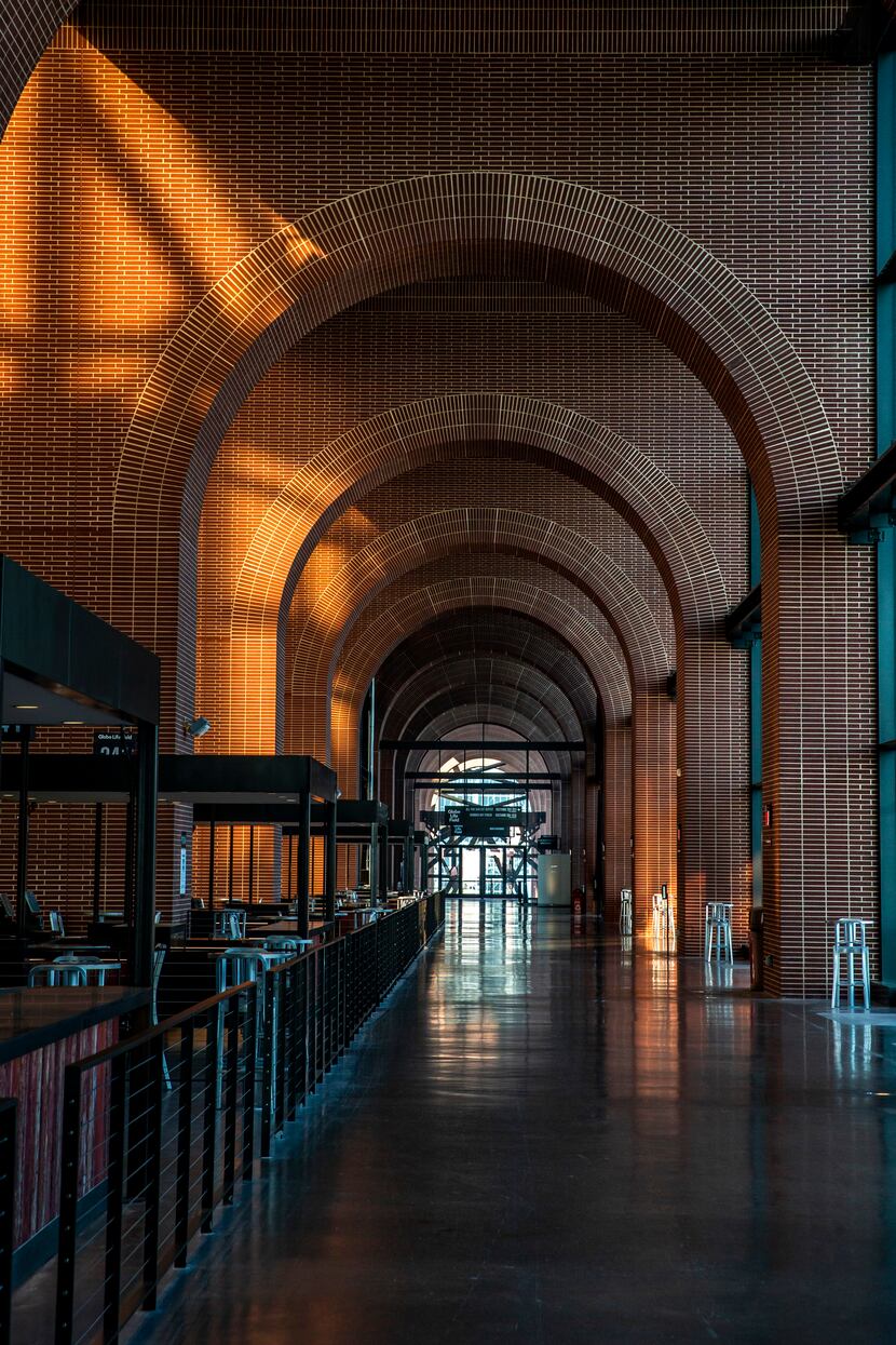 A defining architectural feature of the ballpark is its towering, glass-enclosed arcade of...