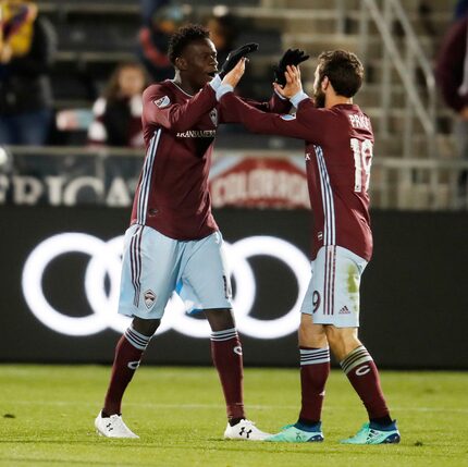 Colorado Rapids forward Dominique Badji, left, celebrates scoring a goal with midfielder...