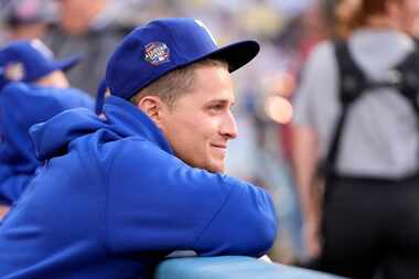 Texas Rangers' Corey Seager smiles after being acknowledged by the public address announcer...