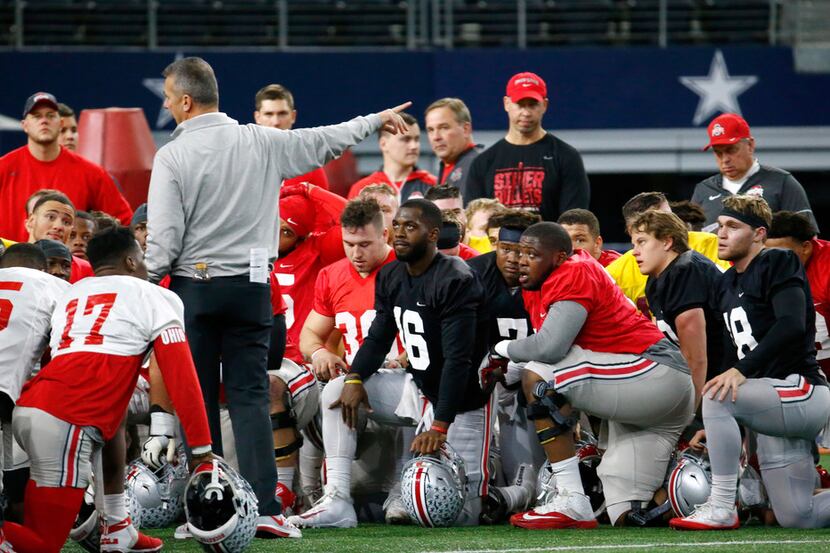 Ohio State's head coach Urban Meyer talks to his team during practice against USC for the...