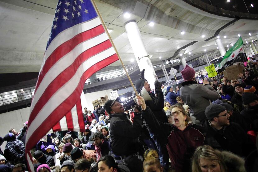 Demonstrators protest agaist President Trump's executive immigration ban at Chicago O'Hare...