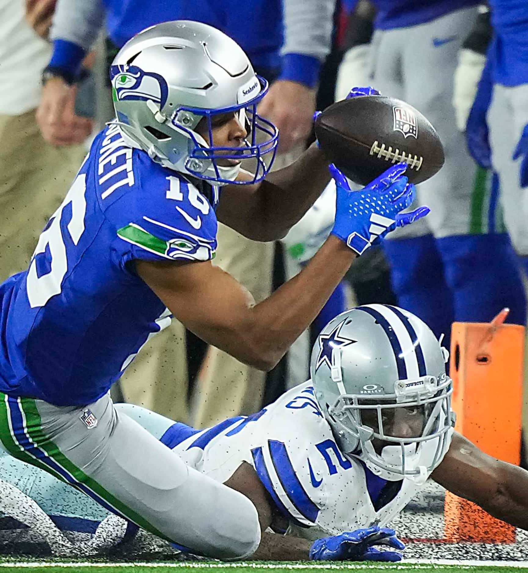 Seattle Seahawks wide receiver Tyler Lockett (16) catches a pass as Dallas Cowboys...