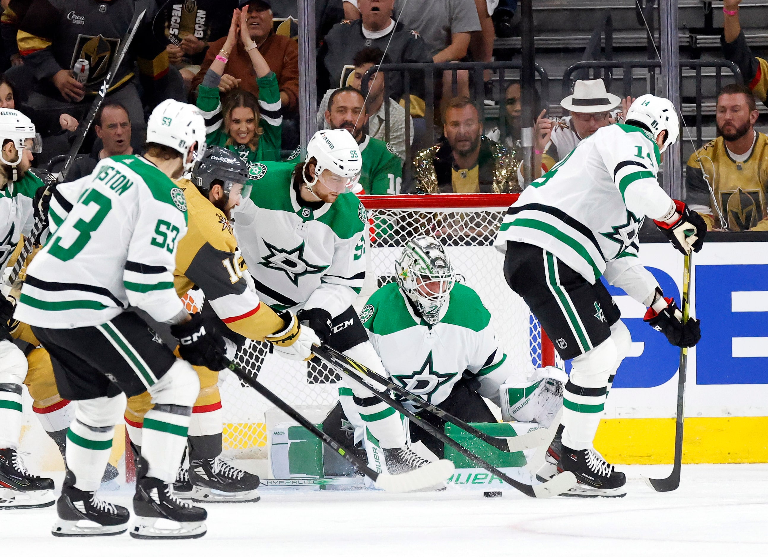 Dallas Stars goaltender Jake Oettinger (29) defends the flurry of shot by the Vegas Golden...