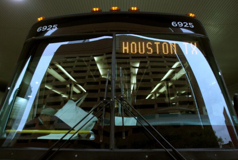 Passengers at Greyhound's downtown Dallas station board one of the new Express buses for...