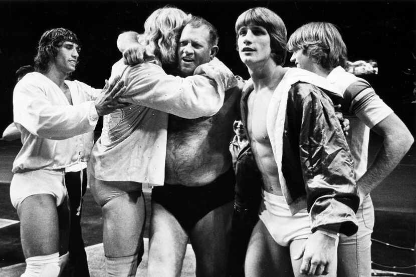 Fritz (center), the father of the Von Erich family of wrestling, including sons Kerry (far...