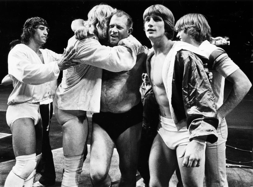 Fritz (center), the father of the Von Erich family of wrestling, including sons Kerry (far...