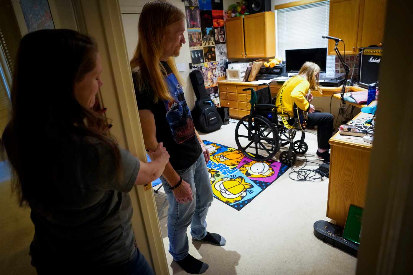 As his parents Tina and Chase Bilbrey listen from the doorway of his room, Korbin Bilbrey...