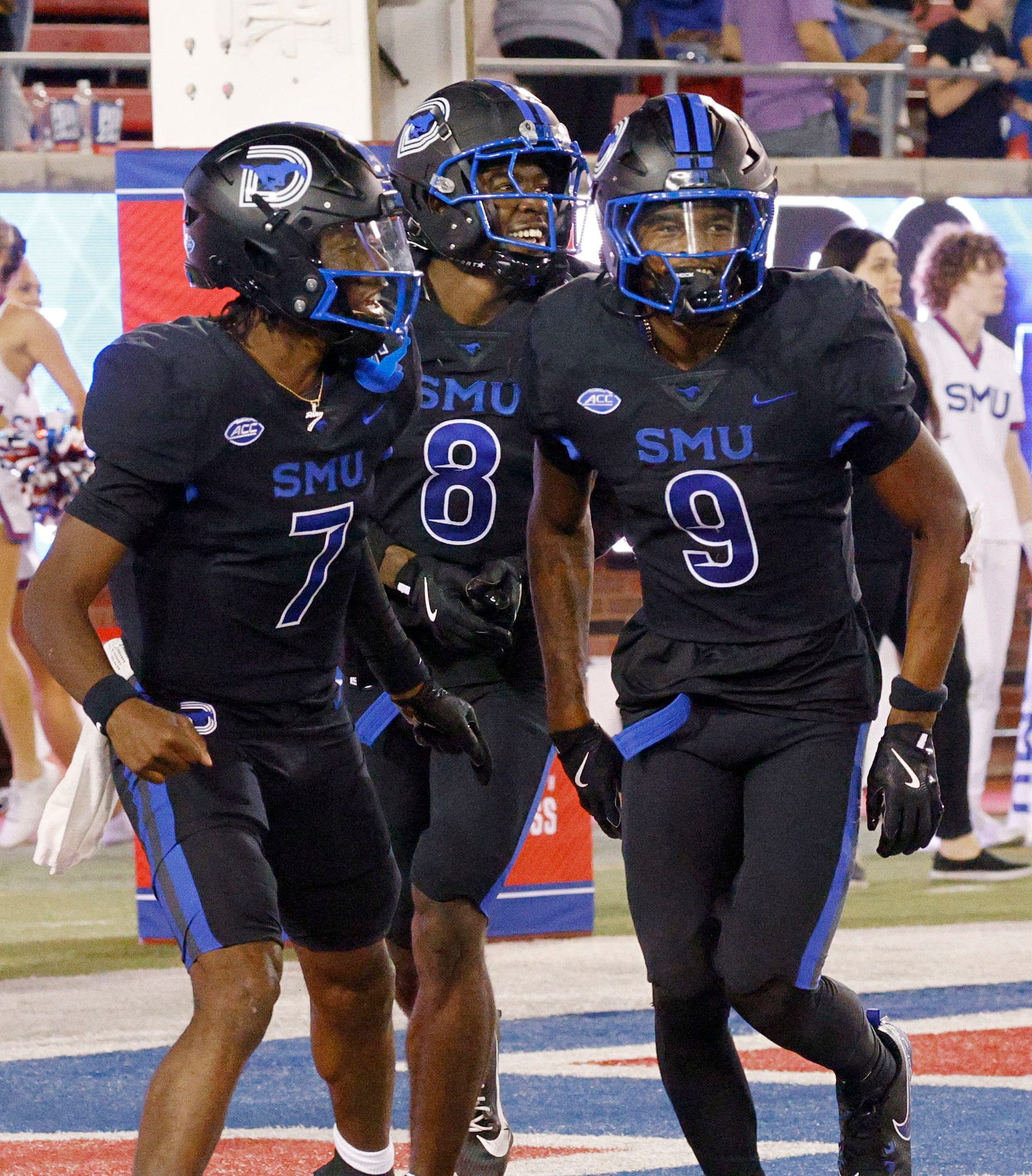 SMU wide receiver Key'Shawn Smith (9) celebrates with his teammates quarterback Kevin...