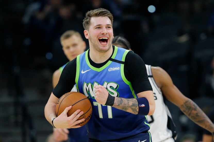 Dallas Mavericks guard Luka Doncic (77) reacts to a play during the second half of an NBA...