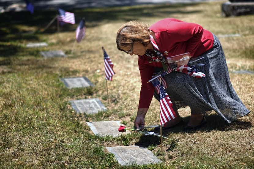  Emina Darakjy leaves a rose in at the gave site of a Civil War Veteran during Memorial Day...