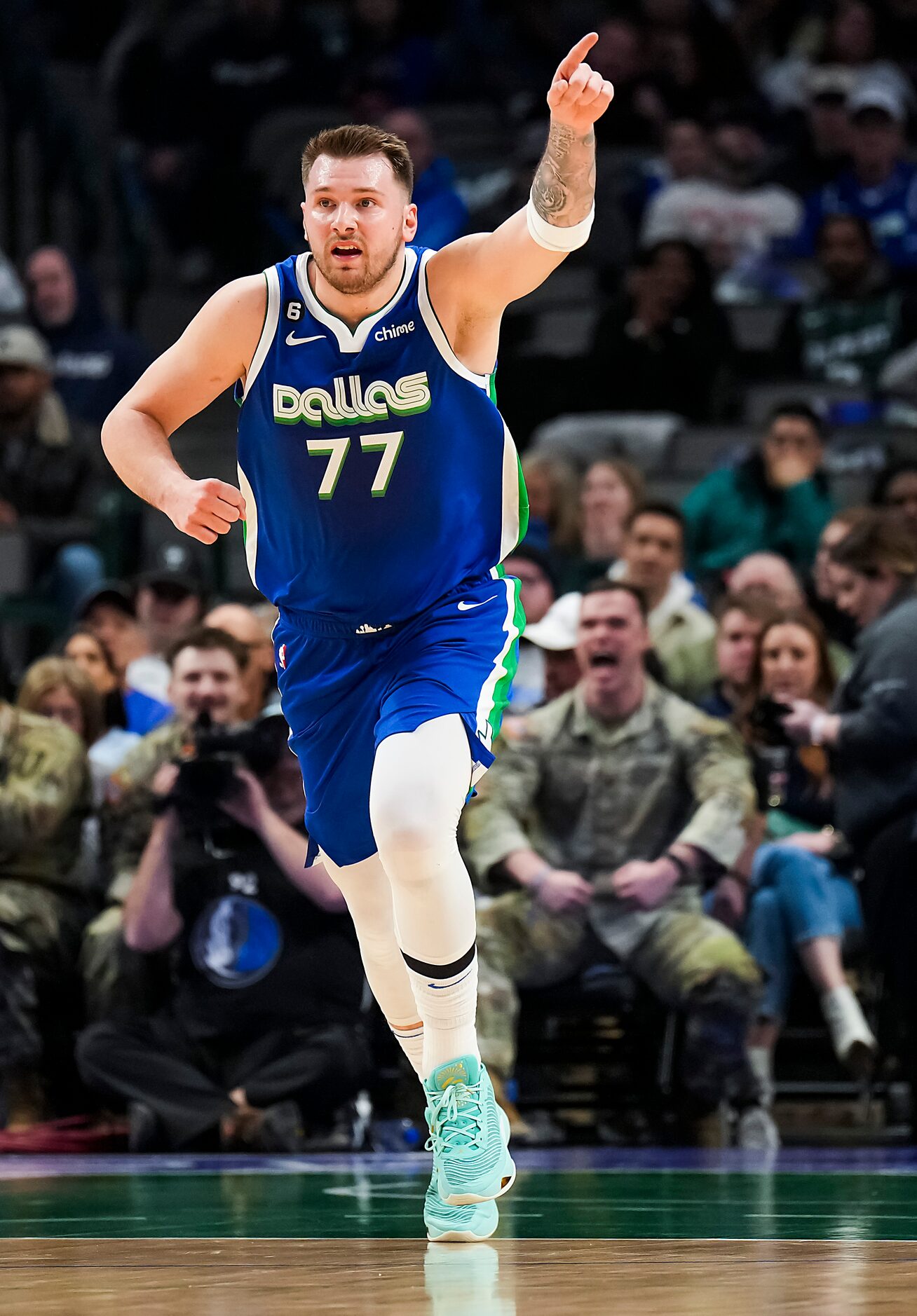 Dallas Mavericks guard Luka Doncic (77) celebrates a basket during the first half of an NBA...