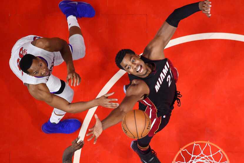 Miami Heat center Hassan Whiteside, right, and Los Angeles Clippers forward Wesley Johnson...