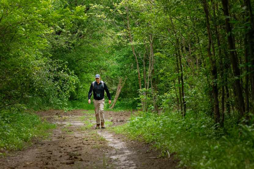 Naturalist Ben Sandifer backtracked through a muddy path during a bird-watching adventure at...