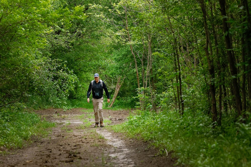 Naturalist Ben Sandifer backtracked through a muddy path during a bird-watching adventure at...