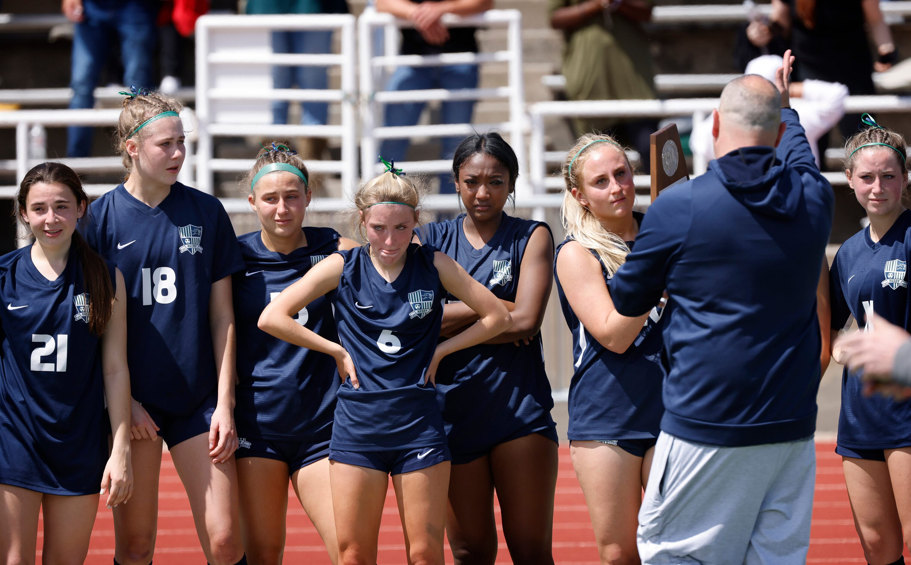 The Frisco Reedy girls soccer team receives their runner-up trophy after their loss to...