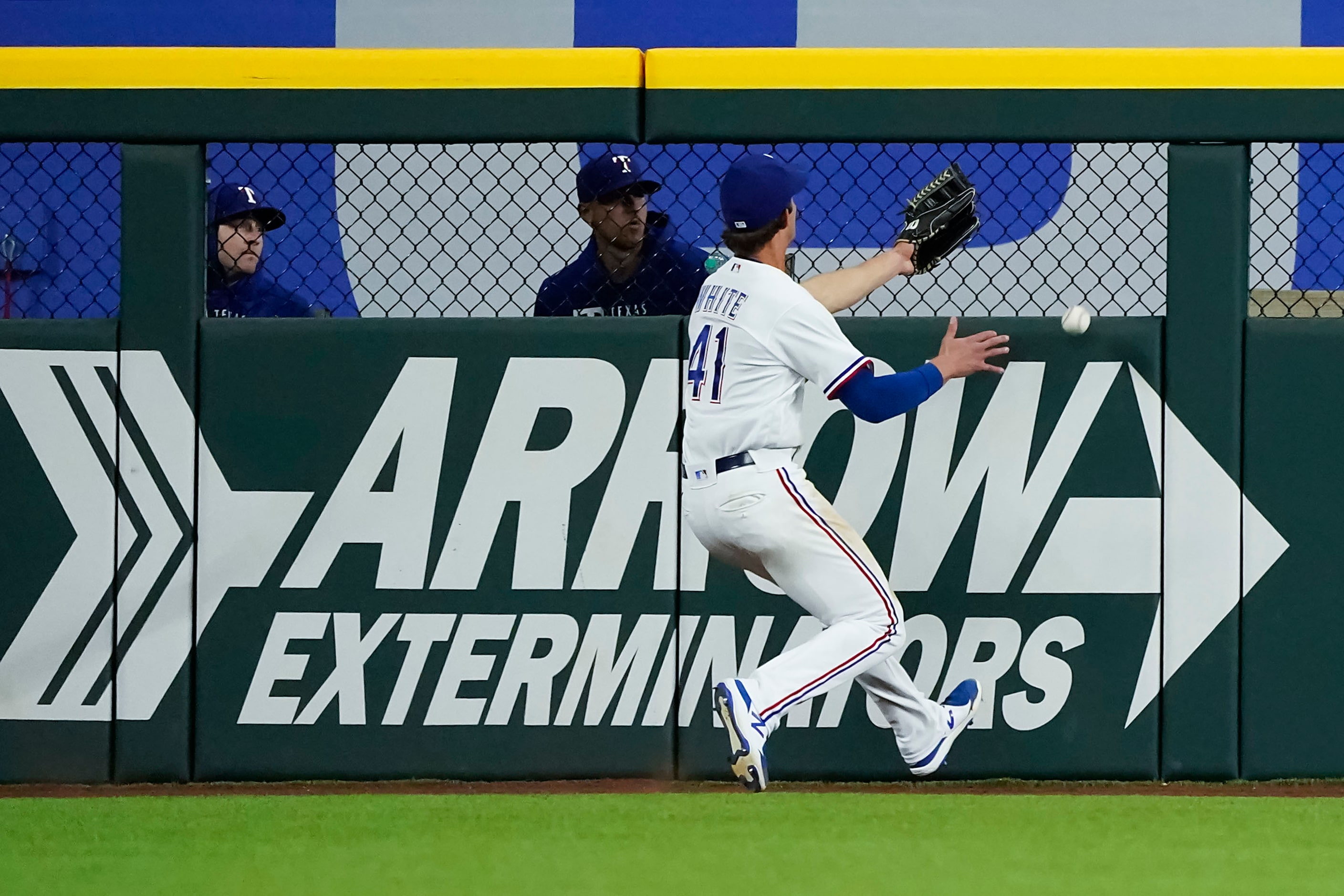 Texas Rangers outfielder Eli White can’t make the play on an RBI double off the bat of San...