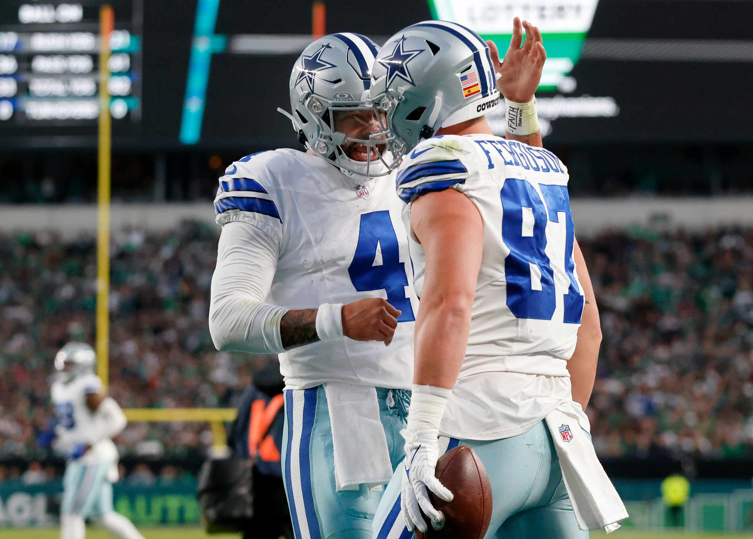 Dallas Cowboys quarterback Dak Prescott (4) congratulates Dallas Cowboys tight end Jake...