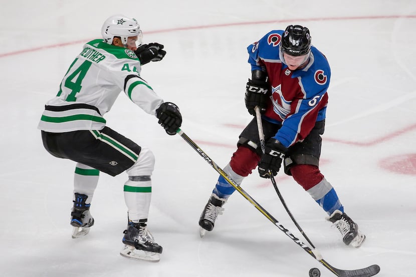 Dallas Stars defender Gavin Bayreuther (44) blocks a shot by Colorado Avalanche's Ty Lewis...