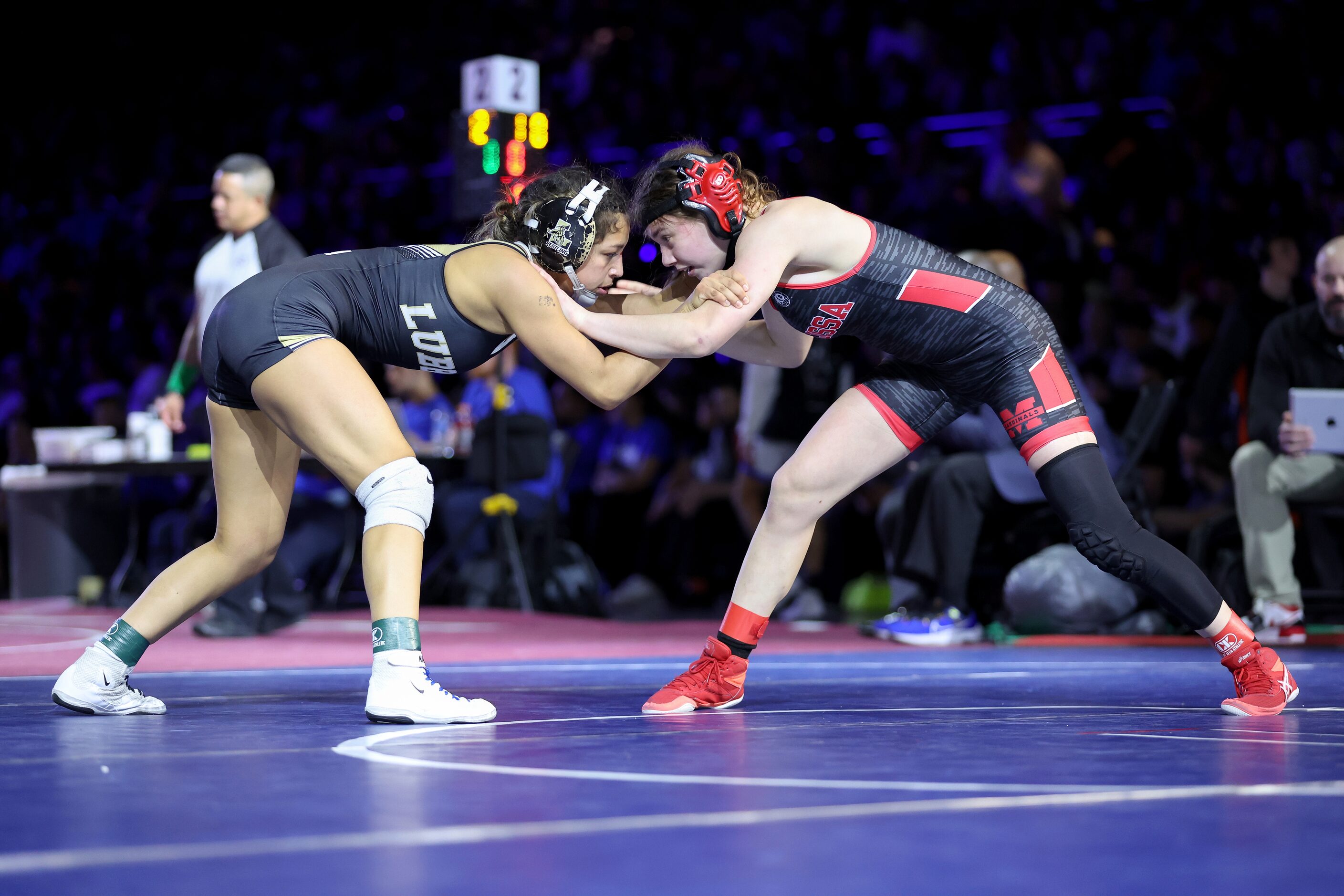 Akeelah Moore of Melissa (red) competes against Madison Pena of Lubbock in the Girls 5A...