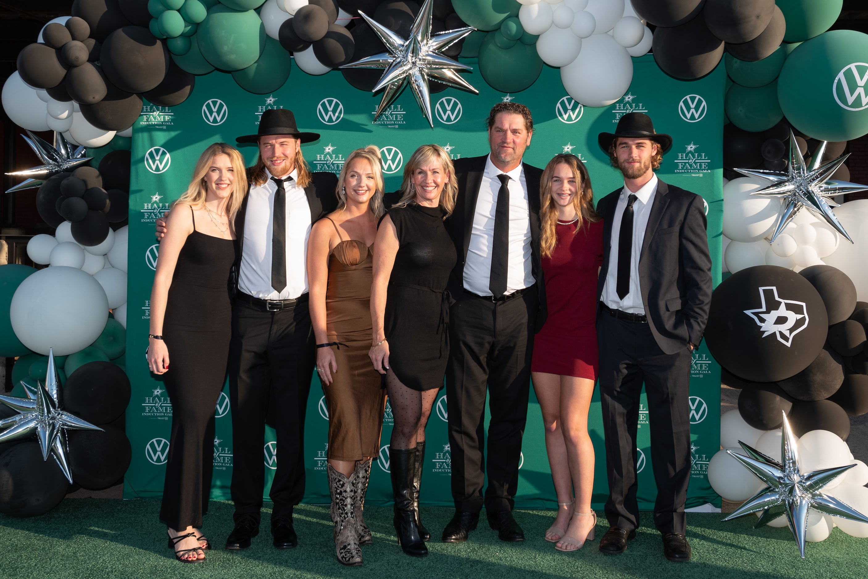 Former Dallas Stars player Derian Hatcher, third from right, and his wife Heather Hatcher,...