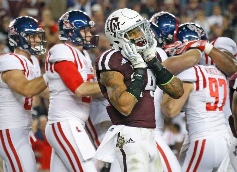 Texas A&M Aggies defensive back Justin Evans (14) can't believe the Aggie victory has...