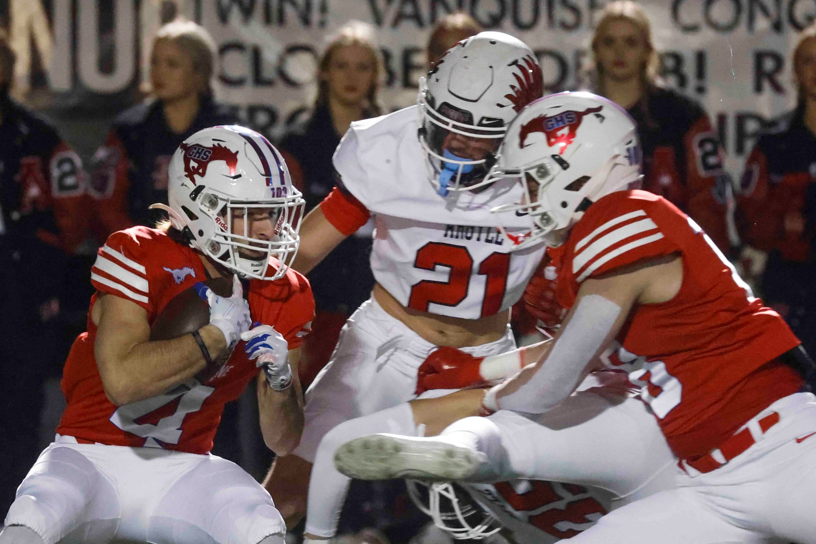 Grapevine High’s Parker Polk (4), left, runs past Argyle High’s Trey Batson (21), center,...