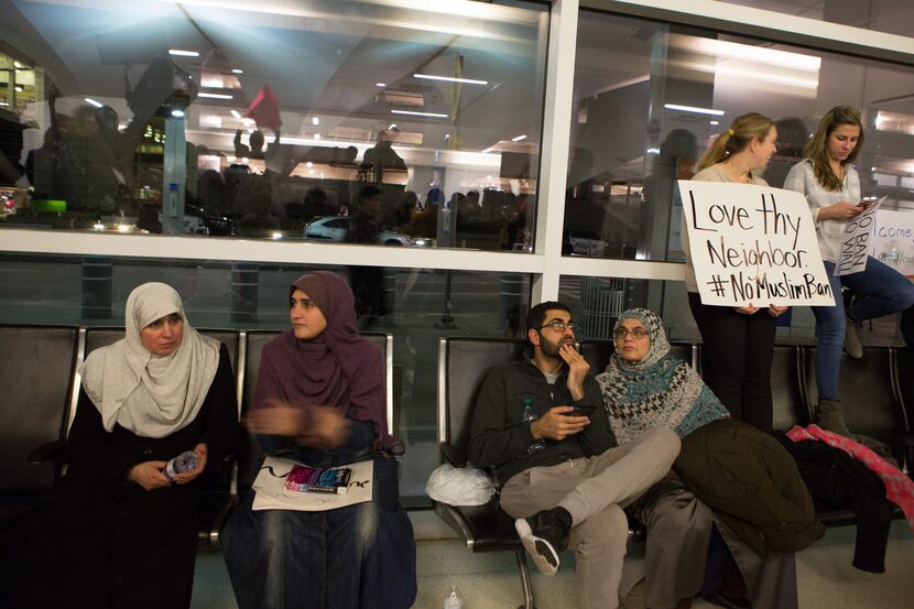 :Protesters gather to denounce President Donald Trump's executive order that bans certain...